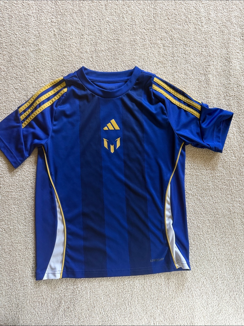 adidas Kids' Pitch 2 Street Messi Training Jersey. Semi lucid blue. 11-12 yrs